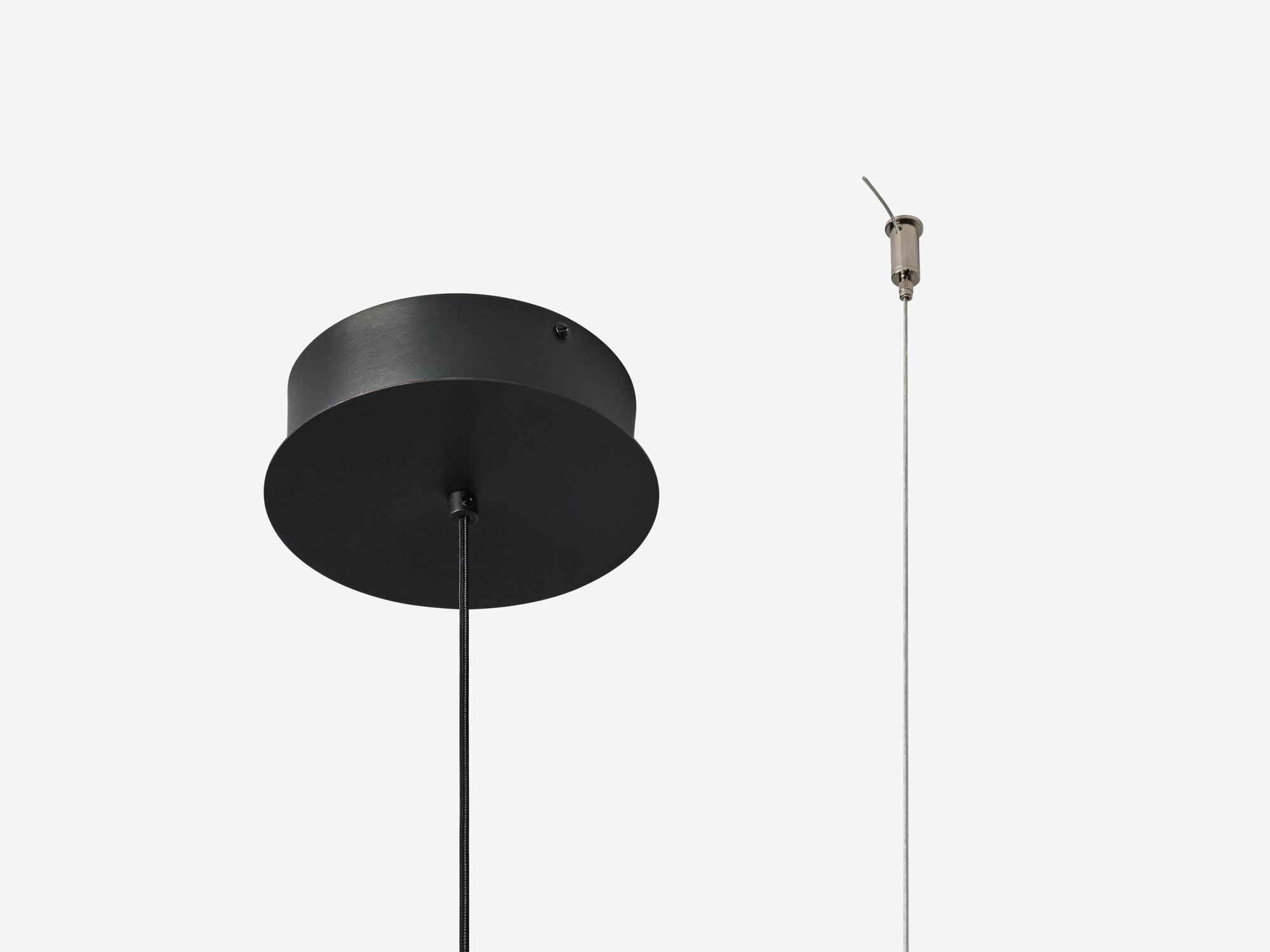 Slim black pendant lamp detail base view